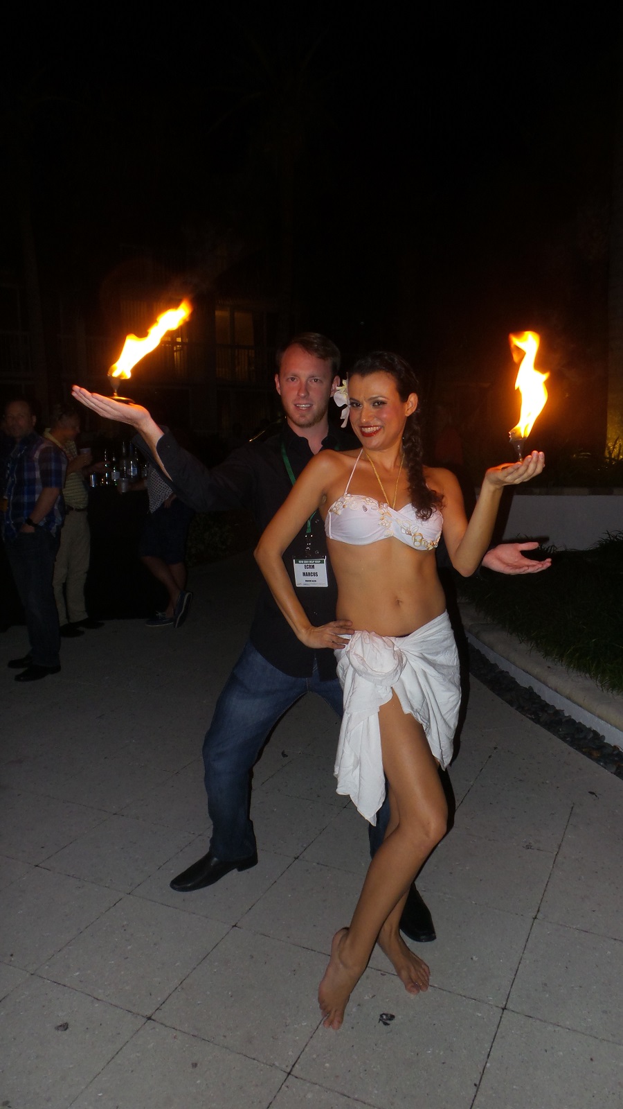 ECRM's Marcus Allen with a fire dancer who performed during dinner